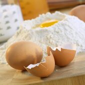 Eggshells & whole egg, egg in well in mound of flour