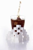 Cola & sugar cubes (picture symbolising high sugar content)