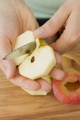 Cutting an apple into quarters