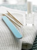 Manicure set on white towels
