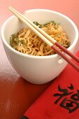 Asian noodle dish with chopsticks