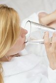 Woman drinking a glass of mineral water