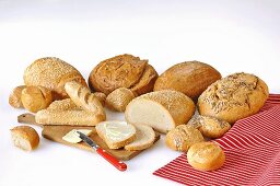 A variety of breads and rolls with butter