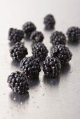 Blackberries on a metal surface