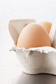 A hen's egg in an egg box