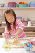 A girl kneading shortbread