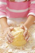 A girl kneading shortbread