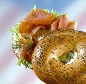 Poppy seed bagel filled with salmon