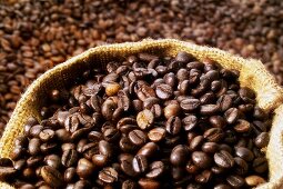 Coffee beans, some in a sack