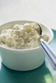 Cottage cheese in a small bowl with spoon