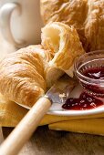 Croissant with jam for breakfast