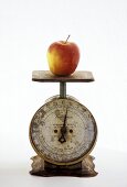 An Apple on a Metal Scale