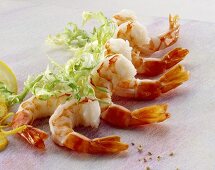 Several shrimp tails and frisée