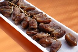 Dried dates in a polystyrene tray