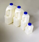 Milk in various plastic bottles