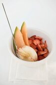 Fruit salad of peach, melon and strawberries