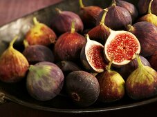 A bowl of whole and halved figs
