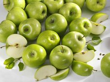 'Granny Smith' apples, whole and cut into pieces