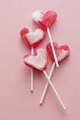 Four heart-shaped lollipops