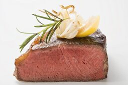 Beef steak with rosemary, garlic and wedge of lemon