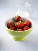 Fresh strawberries in a small bowl