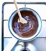 Pan of melted chocolate on a cooker