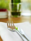 Knife and fork on a fabric napkin