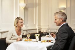 Man and woman having a meal in a restaurant