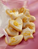 Biscuits of various shapes with lemon icing