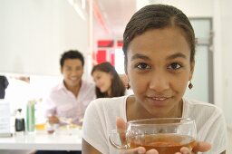 Woman with a cup of tea in an Asian restaurant