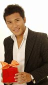 Asian man with gift