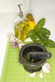 Ingredients for pesto with mortar and pestle
