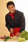Asian chef chopping vegetables