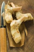 Fresh galanga roots and Asian knife