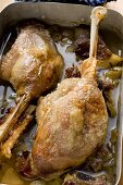 Roast goose legs in roasting tin