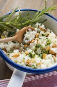 Lemon risotto with pine nuts, pesto and rosemary