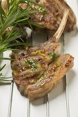 Grilled lamb cutlets with herb oil and rosemary