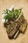 Grilled lamb cutlets with herb oil and rosemary