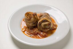 Belly pork rolls with tomato pesto and pine nuts