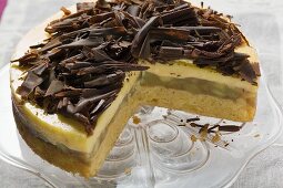 Apple cake with chocolate curls, slices taken