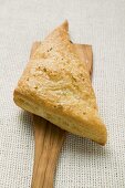 Triangular savoury puff pastry pasty on server