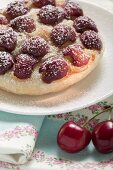 Cherry tart with icing sugar