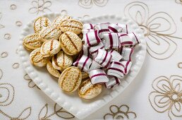 Two kinds of sweets on heart-shaped plate