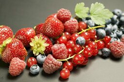Assorted berries with leaves
