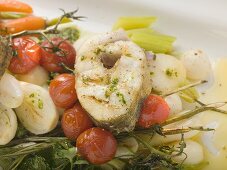 Grilled sea bass cutlet on roasted vegetables