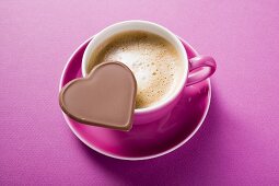 Cup of cappuccino with chocolate heart