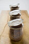 Three chocolate puddings, baked in jars