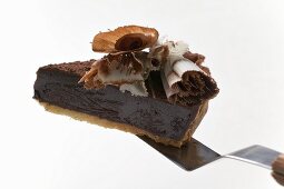 Piece of chocolate tart on cake server