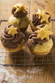 Four Christmas muffins on cake rack