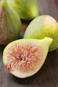 Three whole figs and one half fig (close-up)
